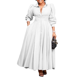 Detailed view of white long sleeve dress featuring pleated waist and shirt collar design