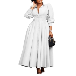 Detail of white long sleeve shirt dress with corset waist and elegant flowing maxi skirt