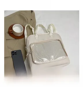 Detail of beige nylon backpack with transparent mesh front pocket for small items