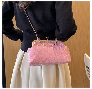 Detail of pink sequin crossbody bag with gold chain strap and fish scale pattern