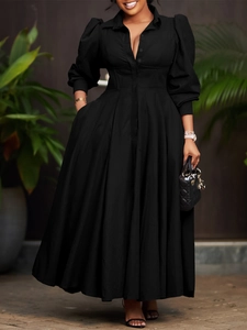 Elegant black long-sleeved shirt dress with a pleated maxi skirt and slim waist design