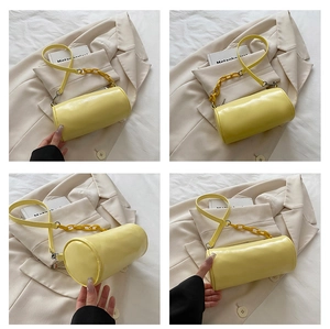 Detail view showing multi-angle yellow cylinder shoulder bag with fashion chain strap