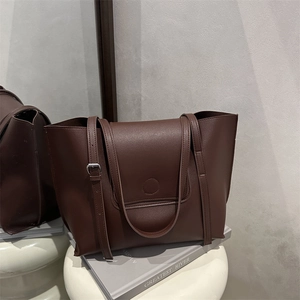 Deep brown large tote bag in pebbled faux leather with adjustable shoulder strap and mirror effect