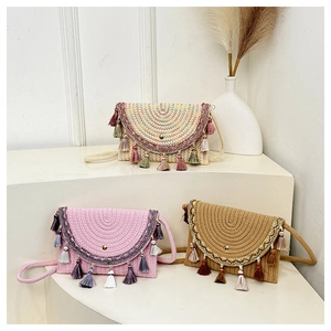 Detailed view of bohemian woven crossbody bags with fringe tassels and ethnic embroidery