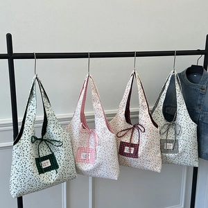 Large floral canvas tote bags with drawstring in green, pink, orange, and black colors