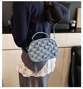 Back view of denim crossbody bag with gradient stars and frayed checkerboard pattern