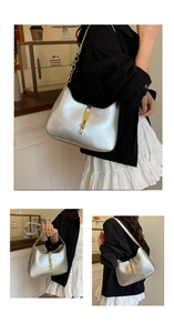 Detailed views of a silver hobo bag with gold piston clasp and chain shoulder strap