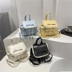 Mini lace-trimmed backpacks with bows in blue, yellow, white, and black colors