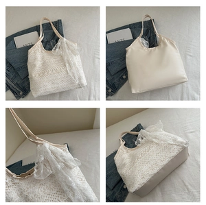 Macro detail of beige tote bag featuring delicate white lace floral crochet and large bow