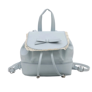 Light blue faux leather backpack with lace trim and bow accent in a front view