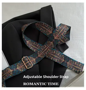 Adjustable wide woven shoulder strap with ethnic geometric patterns on a black blazer