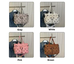 Detail view of stylish tote bags in four colors with quilted pattern and front zip pockets
