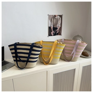 Three colorful woven tote bags in navy, yellow, and purple stripes for casual vacations