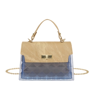 Transparent PVC crossbody bag with blue tint, quilted texture and gold chain strap