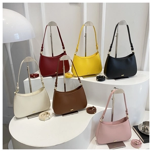 Hobo shoulder bags shown in six colors with adjustable straps on elegant white display