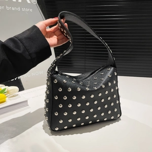 Black pebbled leather tote bag featuring silver stud details and chic shoulder strap