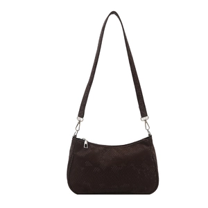 Minimalist dark brown snakeskin embossed shoulder bag with silver hardware on white background