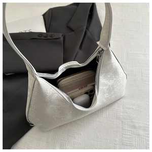 Interior view of white snakeskin texture shoulder bag holding phone and wallet