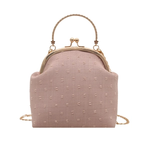 Pink vintage frame clutch bag with dotted embroidery and gold metal handle