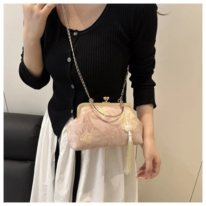 Vintage pink floral lace handbag with gold metal frame and long white flower tassel