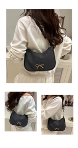 Detailed views of a black corduroy hobo bag with a gold bow metal buckle and shoulder strap