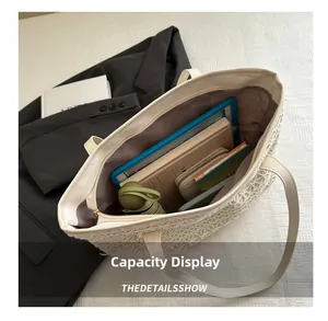 Interior of white woven tote bag showing large capacity for tablet and accessories