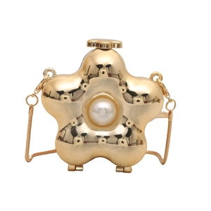 Elegant gold flower metal evening bag with pearl center and snake chain strap
