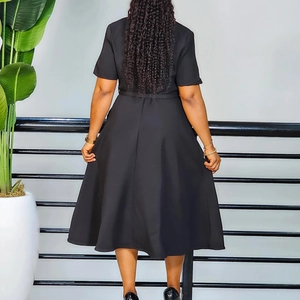 Detail view of the elegant black A-line dress with short sleeves and a belted back design