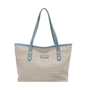 Chic woven tote bag in cream lace with light blue leather straps and gold rivet detail