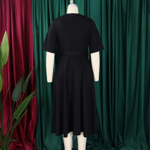 Detail of black V-neck short sleeve dress with adjustable belted waist and flared hem