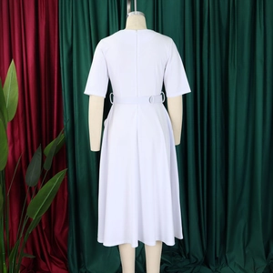 Detail view of the white V-neck dress featuring an adjustable waist belt and A-line silhouette
