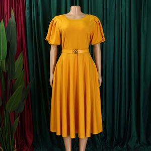 Detailed view of ginger A-line dress with puff sleeves and gold buckle belt