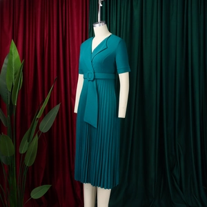 Detail of teal short sleeve V-neck pleated dress with matching square buckle waist belt