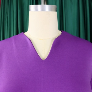 Detailed close-up of the elegant V-neckline on a purple short-sleeved A-line summer dress