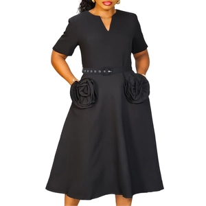 Detail of elegant black V-neck A-line dress with unique 3D rose pockets and waist belt
