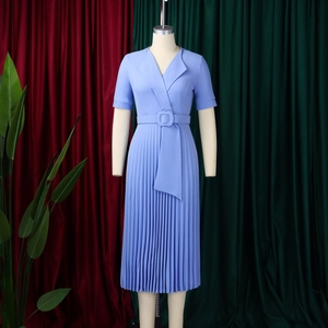 Detail of light blue short sleeve V-neck pleated dress with waist belt and wrap design