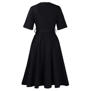 Rear view of black short-sleeved A-line dress with a matching belt on white background