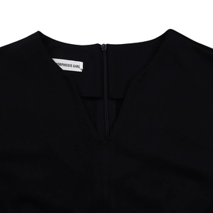 Detail of elegant V-neckline and back invisible zipper on this black A-line dress