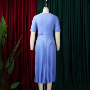 Detail of light blue short sleeve dress featuring pleated hem and matching waist belt