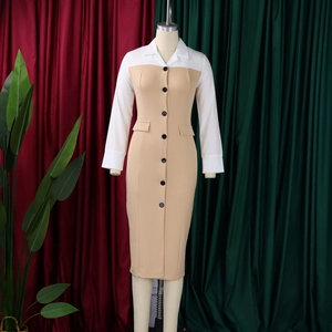 Detail of contrast lapel, black buttons and flap pockets on beige pencil dress