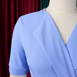 Detail of the light blue V-neck bodice with pleated texture on professional mannequin