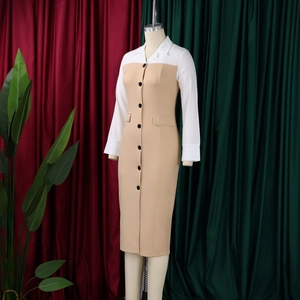 Detailed view of a professional midi dress featuring contrast lapels and front button closure