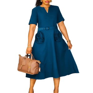 Detail of navy V-neck A-line dress featuring decorative 3D rose fabric flowers on the skirt