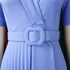 Detail of lavender V-neck dress featuring a pleated skirt and matching square buckle belt