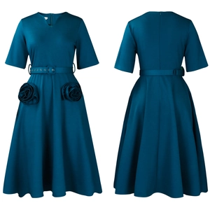 Detailed view of the V-neck dress featuring handmade rose pockets and waist belt