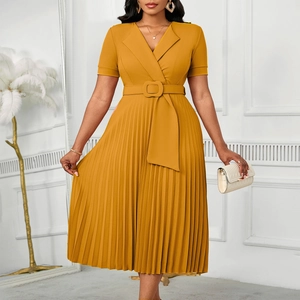 Detail of elegant mustard yellow pleated midi dress with V-neckline and waist belt