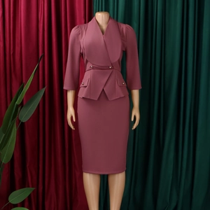 Detail of elegant dusty pink blazer with peplum waist and matching pencil skirt set