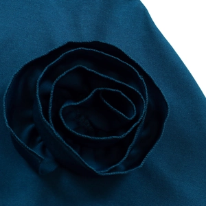 Detailed close-up of dark teal 3D floral fabric rose with premium twill texture