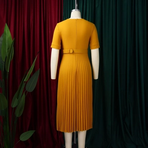 Detail view of mustard yellow pleated midi dress back with matching waist belt