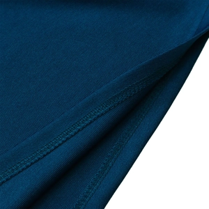 Macro detail of navy blue twill fabric showing high-quality double-needle stitching